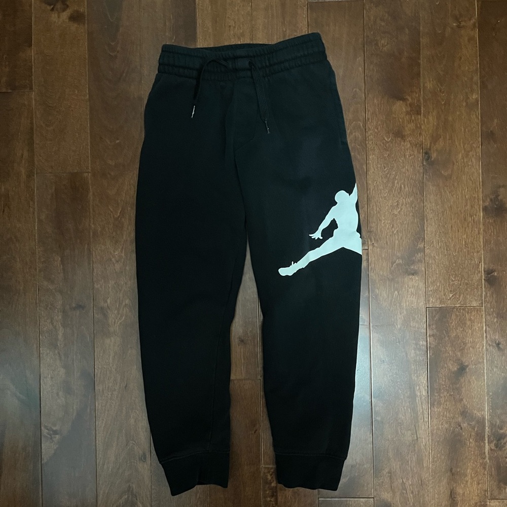 Black Jordan jumpman jogging pants. Size small - 8 - 10 years old.